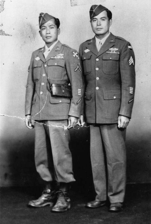 Portrait of Anacieto Soriano, Sr. (at right) and unidentified friend wearing their 1st Filipino Infantry Regiment uniforms from World War II. Copyright © 2011 The Regents of The University of California. Click through for source page.